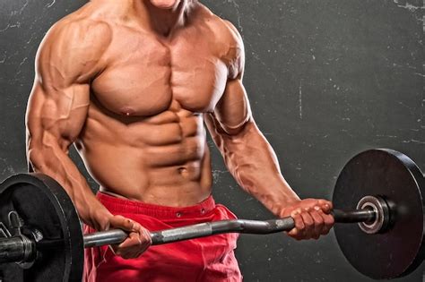 Premium Photo Muscular Men Lifting Weights Studio Shot