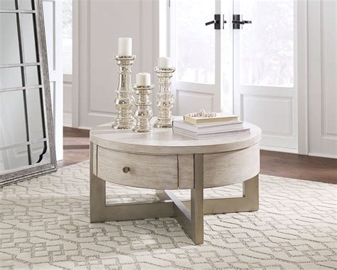 They have classic lines and are often in beautiful wood, making them an ideal piece of furniture for most people. Urlander Round Lift Top Cocktail Table Signature Design ...