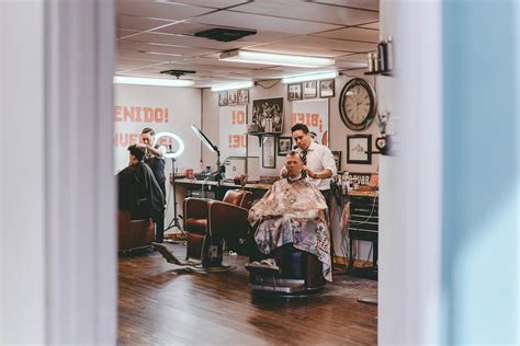 Masters And Customers In Traditional Barbershop · Free Stock Photo