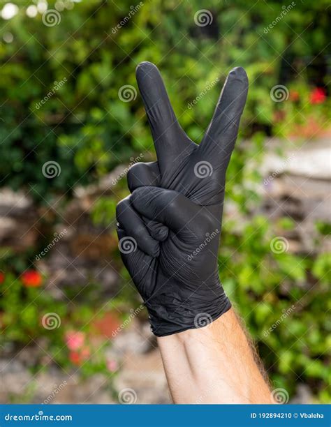 Male Showing Victory Peace Sign Stock Photo Image Of Closeup Gloves