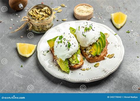 Sandwiches With Avocado Poached Eggs Sliced Avocado And Egg On Toasted