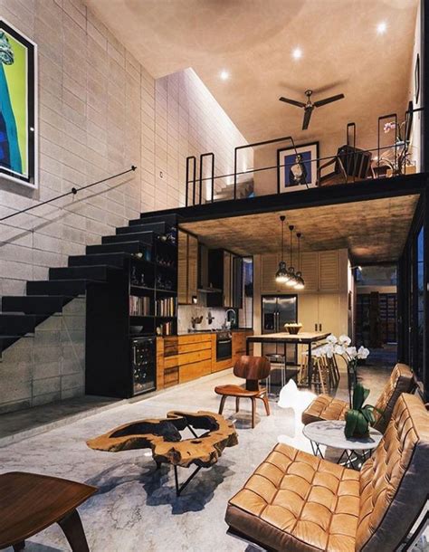 A Living Room Filled With Furniture Next To A Staircase