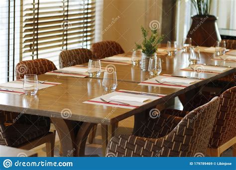 Casual Restaurant Dining Table Set Up With Dark Brown Color Theam