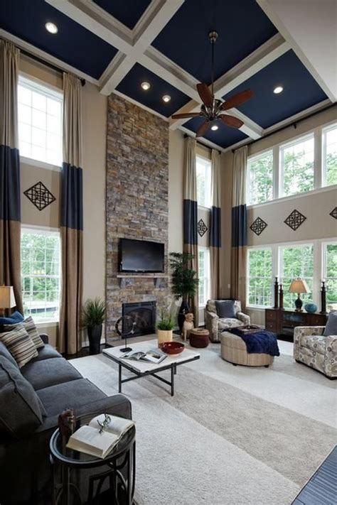 Inviting living room with exposed wooden beams and a high brick fireplace. k hovnanian colorado pictures | Great Room in K. Hovnanian ...