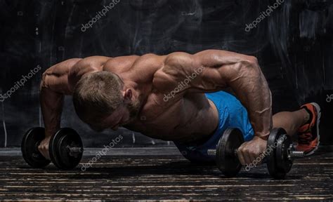 Muscular Bodybuilder Guy Over Darck Background Stock Photo By Bondarchik