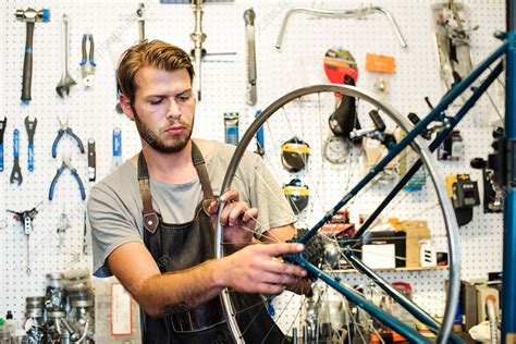 A Man Working In A Bicycle Repair Shop Stock Image F0164551