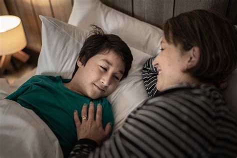 Mother Waking Up Son At Home Stock Photo Download Image Now Bedtime