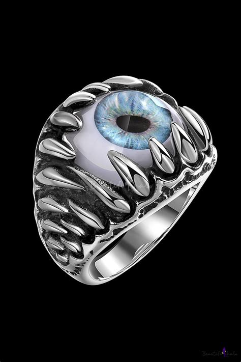 A popular theme for men's rings uses a single center stone surrounded by smaller stones delicately inlaid in pattered rows. Retro Devil's Eye Design New Style Ring for Men ...