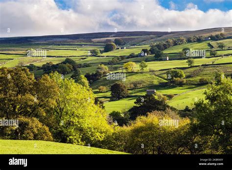 English Countryside And Farms On Hillside Above River Swale In