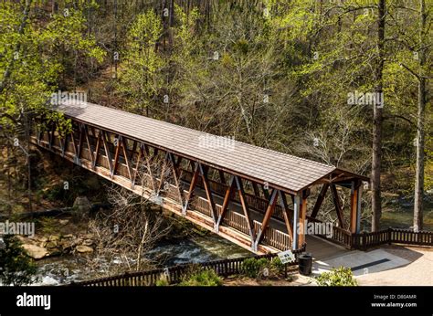 An Old Wooden Covered Bridge In Springtime Forest Stock Photo Alamy