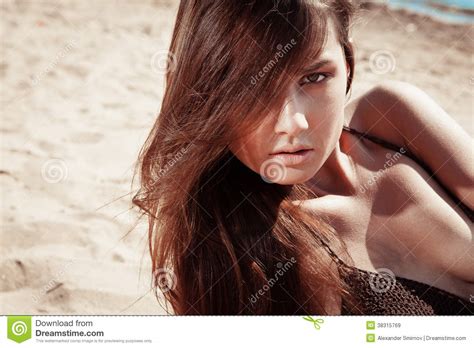 Beautiful Young Brunette Woman On A Sunny Beach Stock