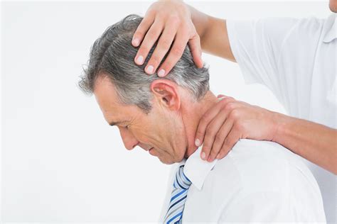 Side View Of A Chiropractor Doing Neck Adjustment Advance