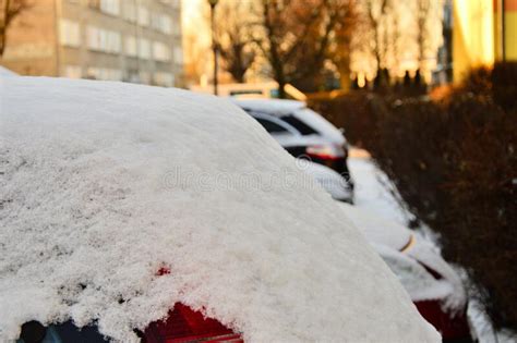 Cars Parked On The Street Covered With A Thick Layer Of Snow Stock