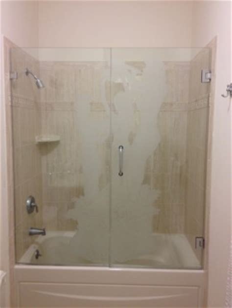Frameless bathtub shower screen, swing door, 60 x 33.5, 5/16 (8mm) glass, brushed nickel hinges. » Frosted Units New Images Mirror & Glass Co.