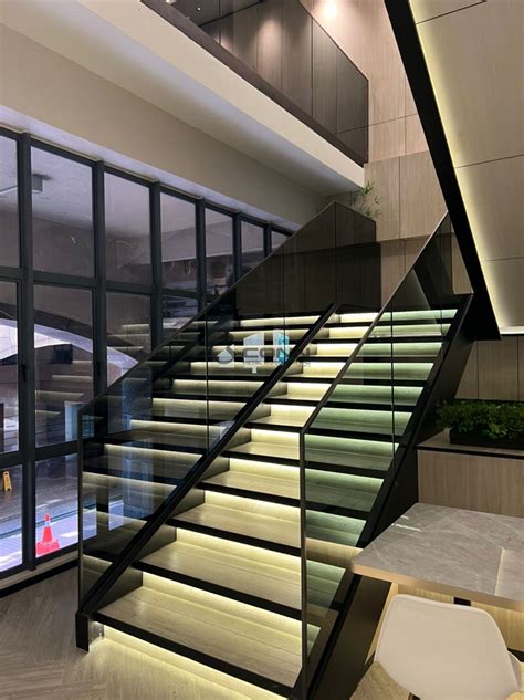 Mild Steel Staircase Structure With Glass Handrail And Titanium Topping