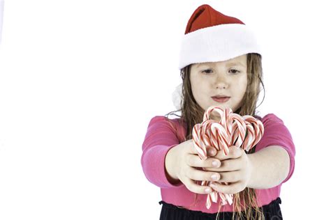 Young Girlg Holding Candy Canes Table Canes Sucker Photo Background And