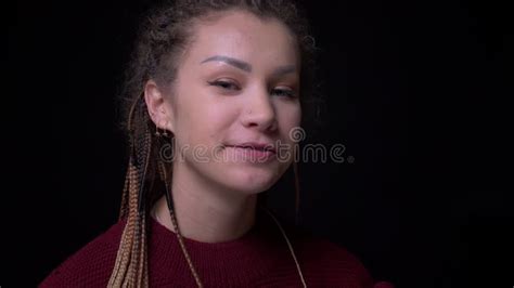 Eccentric Brunette Girl With Piercing And Dreadlocks Smiles Happily And