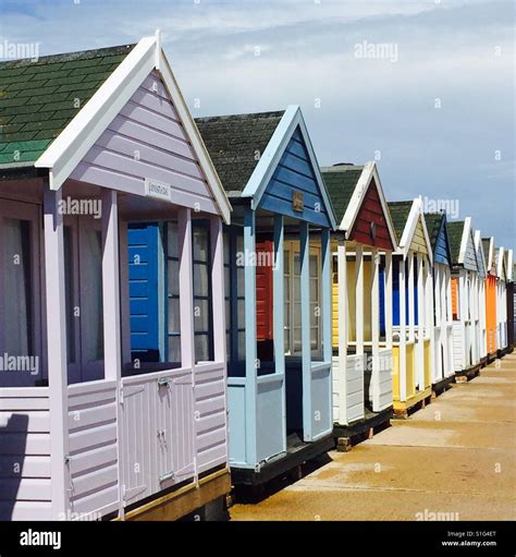 Brightly Coloured Beach Huts In Southwold Stock Photo Alamy