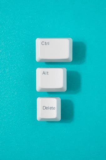 Control Alt And Delete Retro Keys On A Teal Background Stock Photo