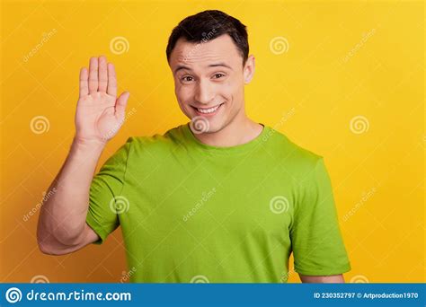 Portrait Of Friendly Guy Beaming Smile Wave Hand Hello Gesture On