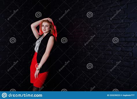 Portrait Of An Attractive Redheaded Girl In Sleveless Jacket Stock