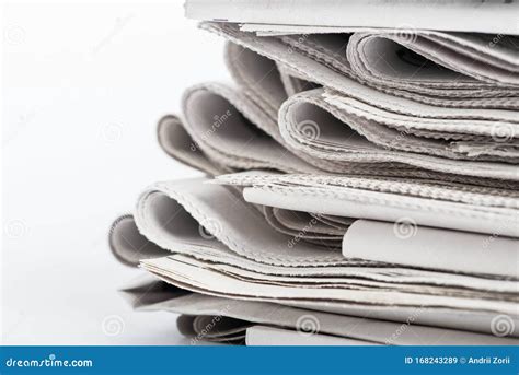 Newspapers Folded And Stacked Pile Of Old Newspapers On A White
