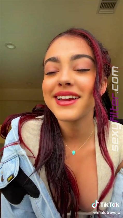 hot malu trevejo shows cleavage in grey overall braless