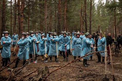 At Mass Grave Site In Ukraines Northeast A Sign Of Occupations Toll