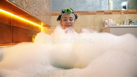 Pretty Woman Taking Foamy Bath And Playing With Soap Foam Stock Image