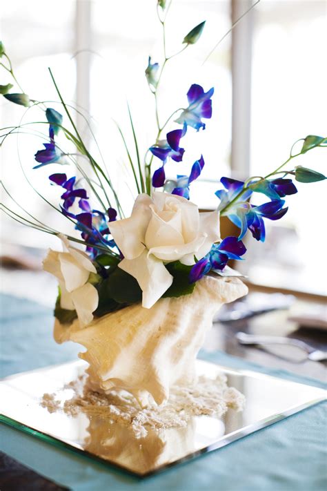 Wedding flowers are one of the most stand out elements to your special day, providing elegance, fragrance or even a fun pop of color. eletragesi: Blue Orchid Flower Centerpieces Images