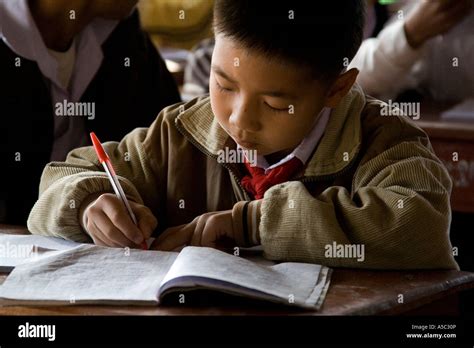 Boy Writing In Notebook In Class Hongsa Laos Stock Photo Alamy