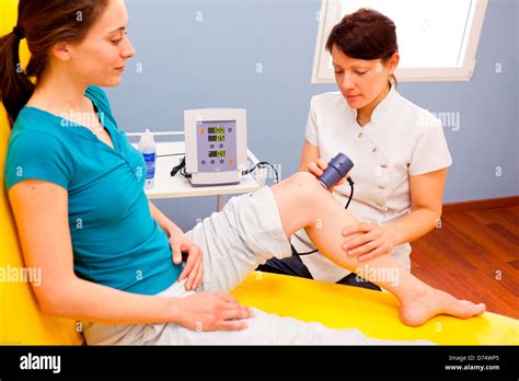 Ultrasound Physiotherapy Treatment Of Knee With Ultrasounds Stock