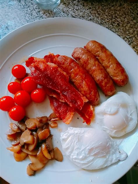 Homemade Breakfast With Sausages Bacon Eggs Garlic Mushrooms And