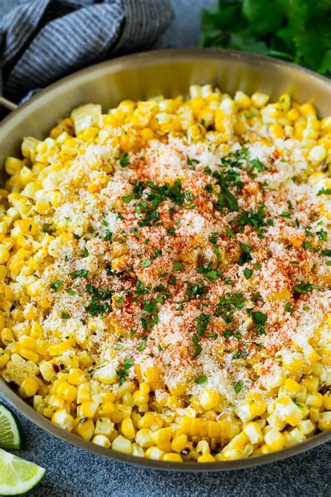 Let the corn sit for a few minutes until cool enough to handle. Mexican street corn in a pan topped with cotija cheese ...