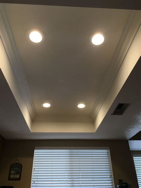 I find guides for installing recessed or fluorescent fixtures in suspended ceilings and guide for installing flush mount fixtures in traditional drywall but not flush mount to suspended ceilings. Removed old lighting, Installed LED's, Crown molding ...