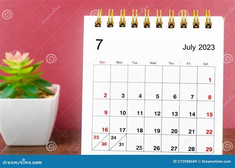 Close Up The July 2023 Monthly Desk Calendar On Wooden Table Stock