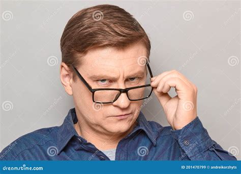 Portrait Of Serious Man Looking Over Glasses At Something Interesting Stock Image Image Of