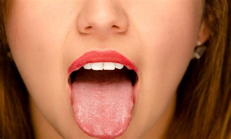 55226600 Closeup Young Womans Open Mouth With Tongue Sticking Out Blog Tiqdiet