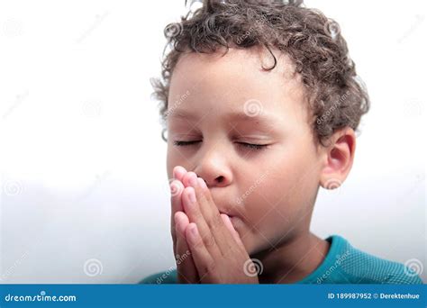 Boy Praying To God With Hands Held Together Stock Photo Stock Photo