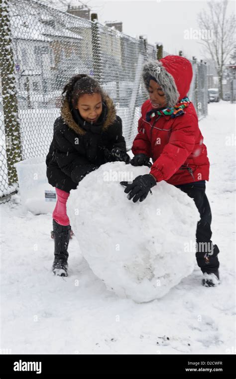 Rolling A Big Snowball Hi Res Stock Photography And Images Alamy