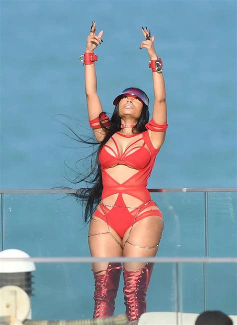 Nicki Minaj Shows Off Her Famous Curves In A Red Cutout Bodysuit
