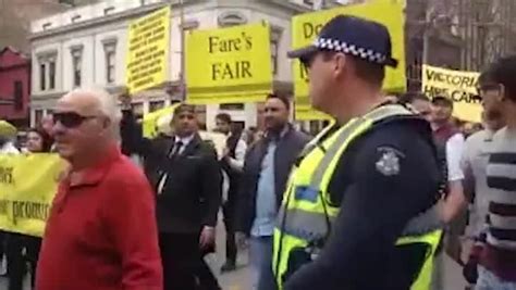 Police officer are pictured threatening protestors with pepper spray as tempers flare. Taxi drivers protest in Melbourne | Herald Sun