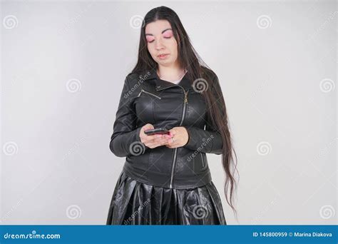 Fashionable Alternative Girl Wearing Anime Shirt And Leather Skirt With