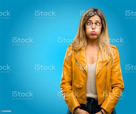 Puffing Out Cheeks Having Fun Making Funny Face Stock Photo Download