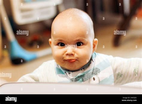 Sweet Funny Baby With Big Eyes And Chubby Cheeks Stock Photo Alamy