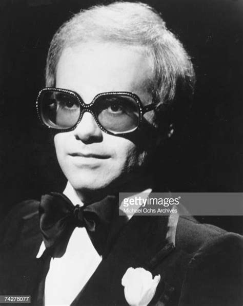 Pop Singer Elton John Poses For A Portrait Wearing Glasses And A Bow