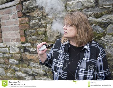 Mature Woman Smoking An Electronic Cigarette Stock Image Image Of