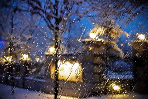 Rain Drops On Window With Street Bokeh In Winter Stock Photo Image Of