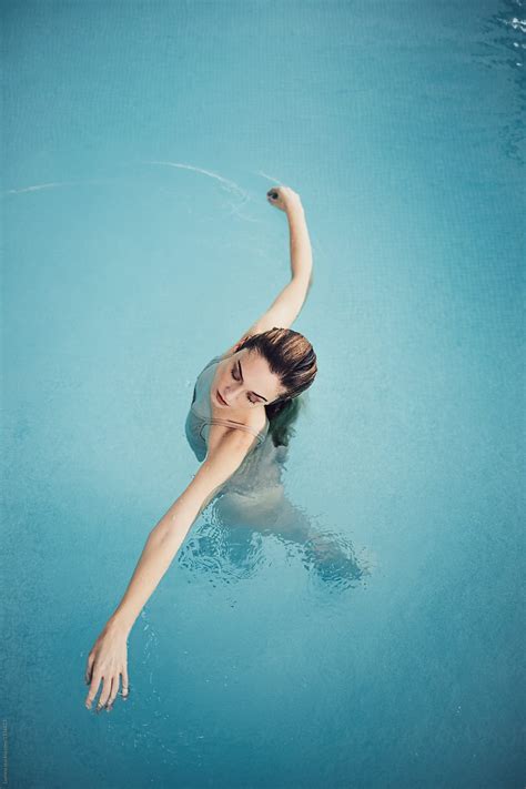 Woman Enjoying Swimming Pool By Stocksy Contributor Lumina Stocksy