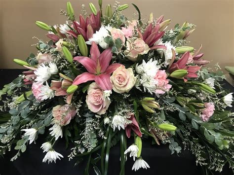 If you are the person making this purchase, you'll want only the best flowers and arrangement to adorn the casket of your loved one. PINK LILY CASKET SPRAY - Petals Flower Shop & Florist